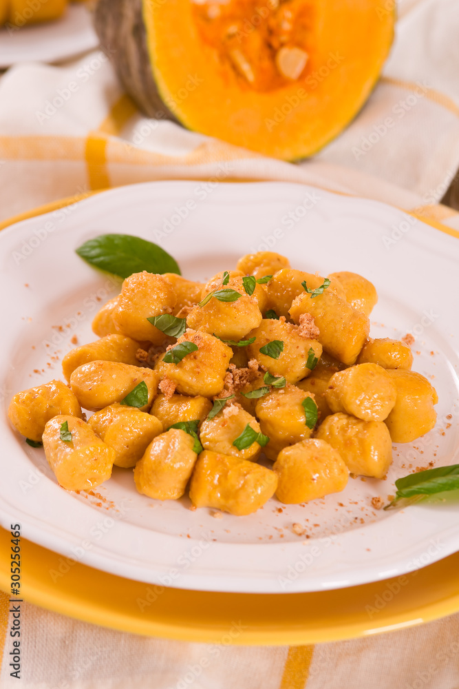 Pumpkin gnocchi with grated amaretti cookies.