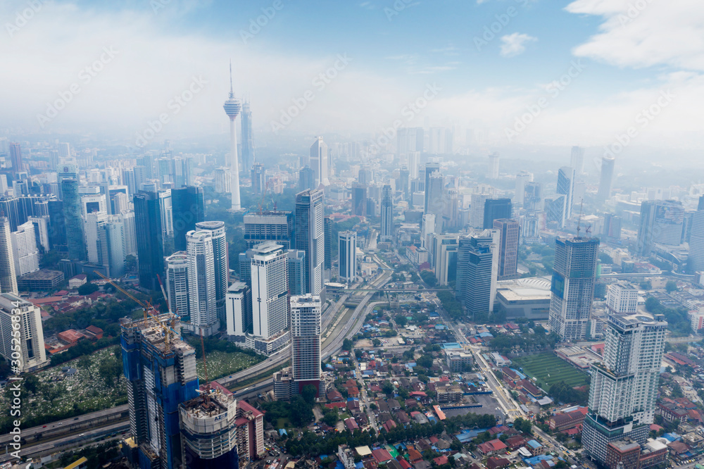 KUALA LUMPUR - Malaysia. November 12, 2019: Aerial view of KL tower in Kuala Lumpur CBD area shot at midday over blue sky