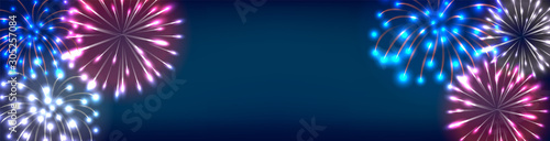 Colorful fireworks on dark blue sky. New year horizontal web banner