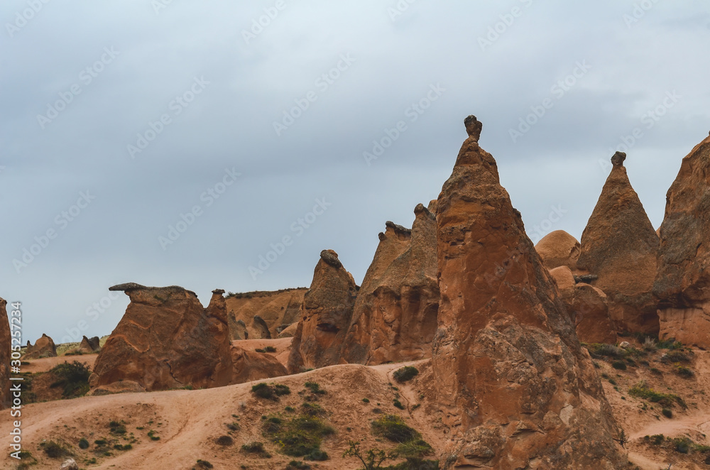 Rocks of bizarre unusual form of volcanic rock in Turkish Cappadocia.