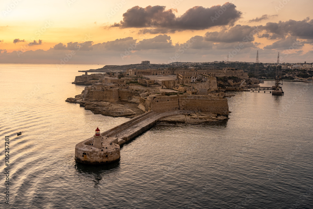 view on lighthouse of valetta at sunset, malta