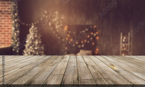 Wooden desk on bokeh blur abstract christmas background