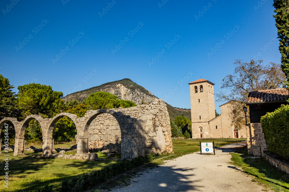 San Vincenzo al Volturno, a Benedictine monastery in Castel San Vincenzo and Rocchetta a Volturno. The new abbey. The remains of walls of an ancient building, with a series of stone arches.