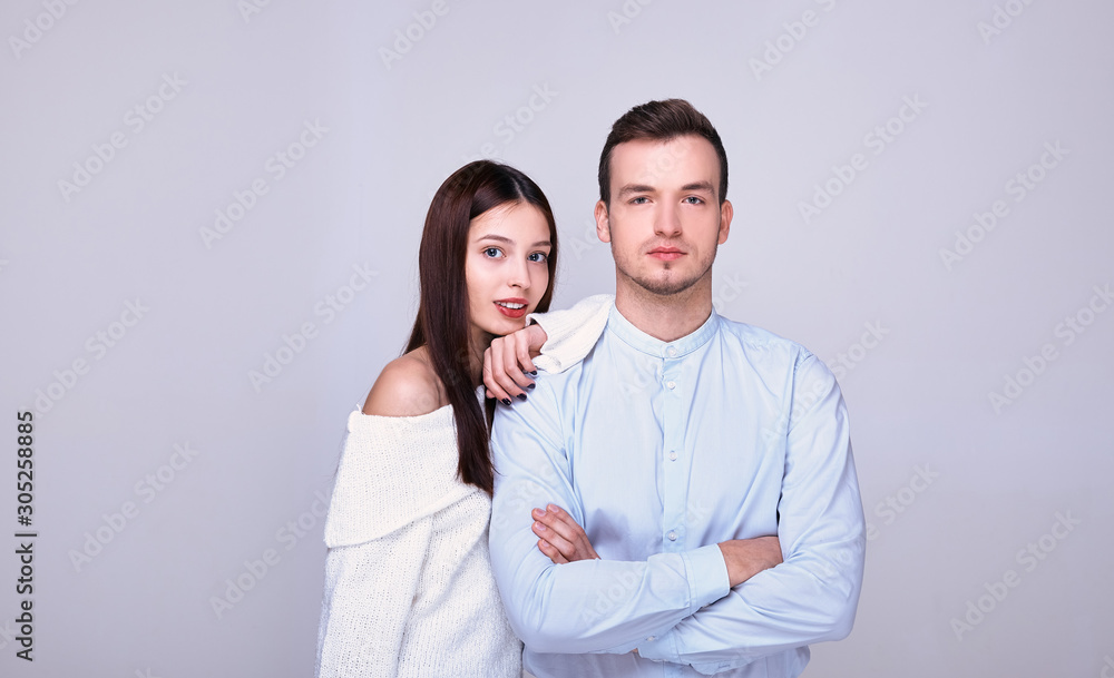 Beautiful young couple on the background. Beautiful young couple on the background.