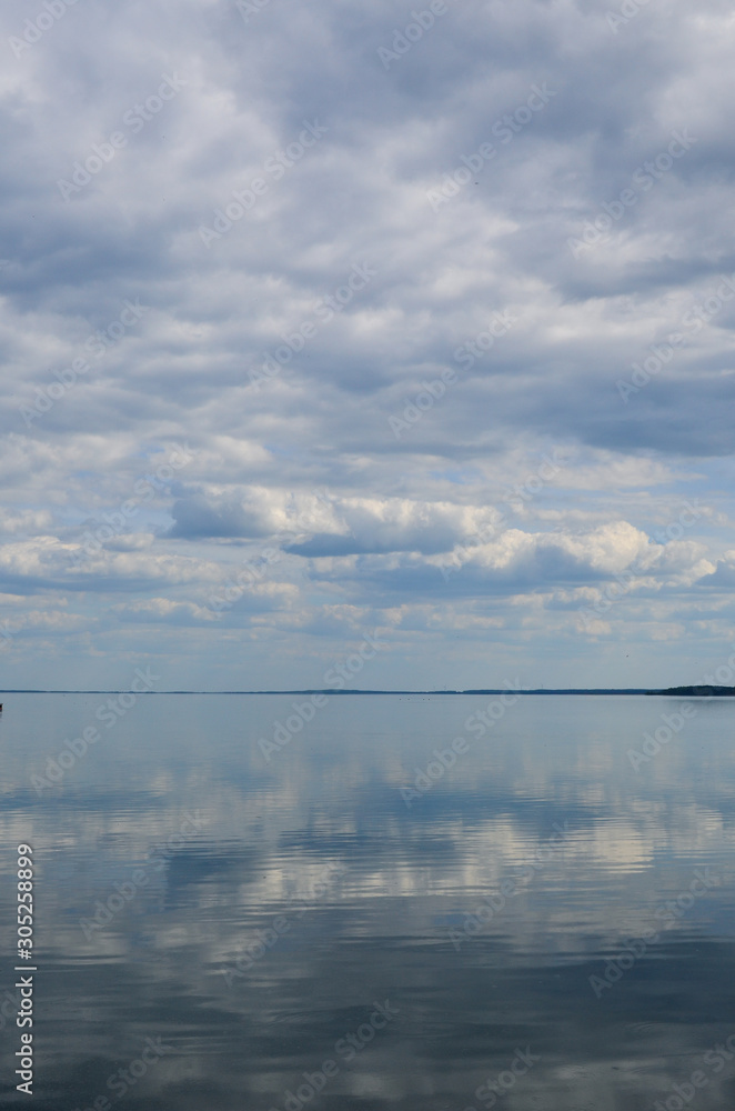 Clouds reflection in the water landscape vertical