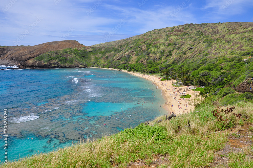 Snorkelling at the coral reef of Hanauma Bay, a former volcanic crater, now a national reserve near Honolulu, Oahu, Hawaii, United States.