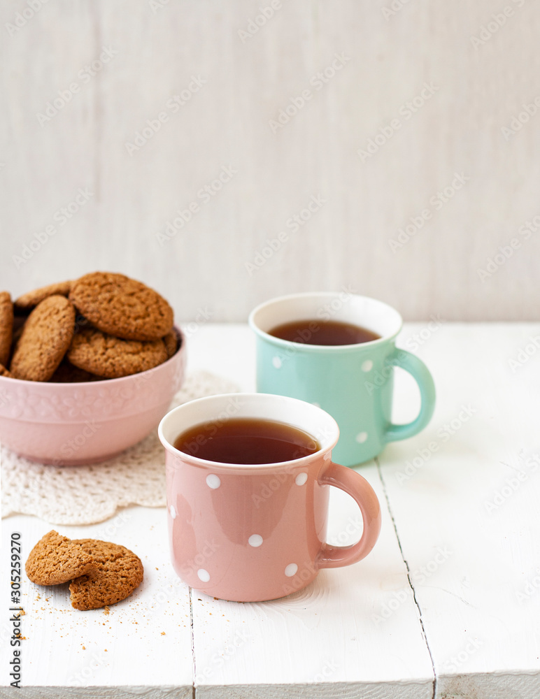 A tasty snack: two cups of tea and a bowl of cookies... A tasty snack: two cups of tea and a bowl of cookies...