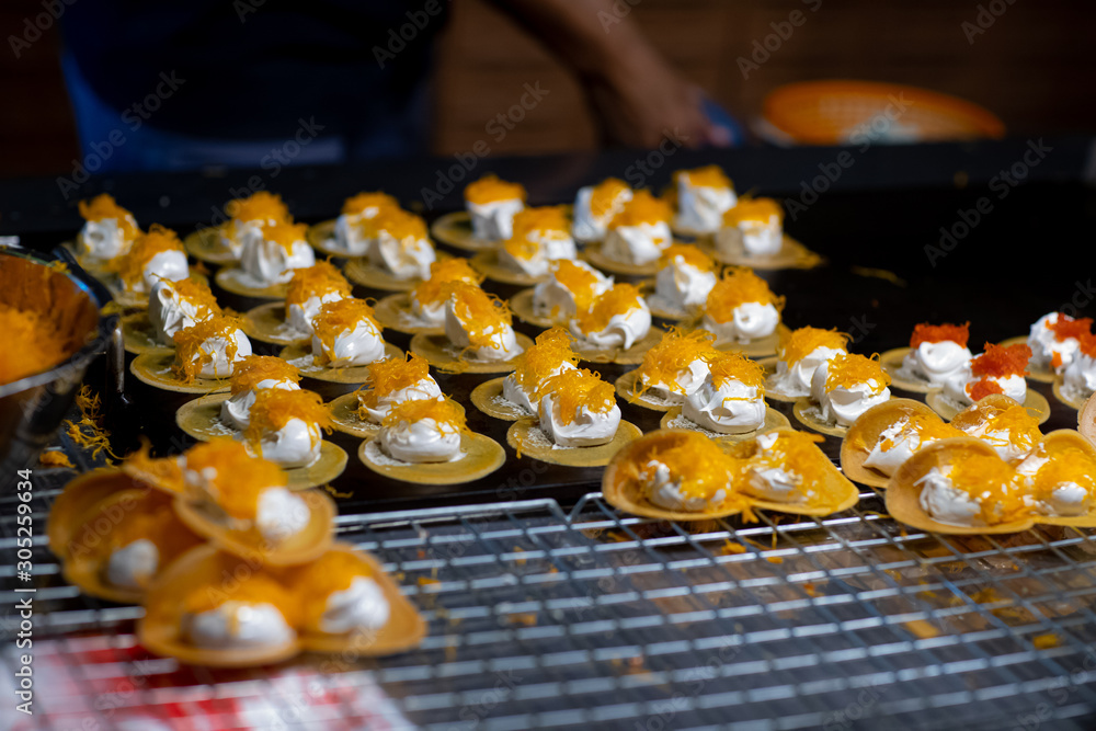 Traditional Thai desserts at Street food in thai temple festival fair (Thai Crispy Pancakes) Traditional Thai desserts at Street food in thai temple festival fair (Thai Crispy Pancakes)
