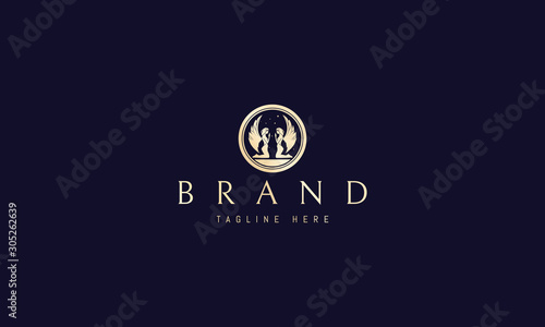 Vector golden logo on which an abstract image of angels.