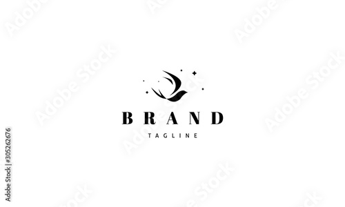 Vector black logo on which an abstract image of a flying swallow.