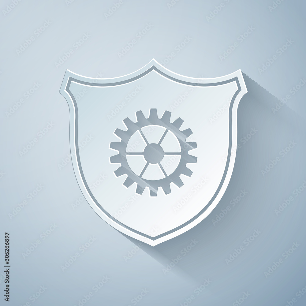 Paper cut Shield with gear icon isolated on grey background. Paper art style. Vector Illustration Paper cut Shield with gear icon isolated on grey background. Paper art style. Vector Illustration