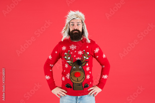 Take him from work to xmas party. Bearded man with festive playful look. Unshaven man in winter style. Hipster man in new year reindeer design jumper. Brutal man with long beard wear warm clothes