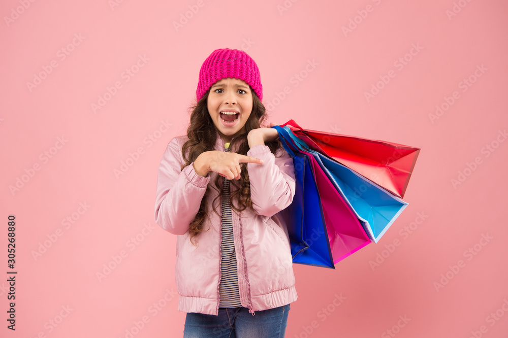 Winter shopping. Buyer consumer concept. Christmas sale. Kid fashion. Holiday purchase saving. Home shopping. Small girl with shopping bags. Sales and discounts. Happy child. Little girl with gifts Winter shopping. Buyer consumer concept. Christmas sale. Kid fashion. Holiday purchase saving. Home shopping. Small girl with shopping bags. Sales and discounts. Happy child. Little girl with gifts