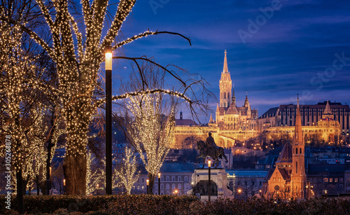 View on the famous Fishermen's Bastion in Budapest in winter with christmas lights