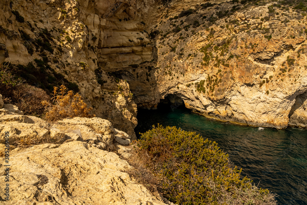 view of malta coast and mediterranean sea at blue grotto, malta