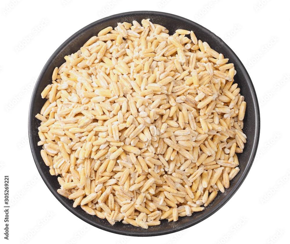 wheat grains in a black plate isolated on white background. top view wheat grains in a black plate isolated on white background. top view
