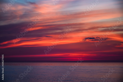 Red sunset on the beach in Saulkrasti. © Ivars