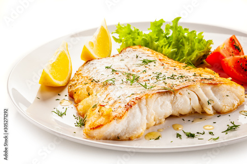 Wall Mural Fish dish - fried fish fillet with vegetables