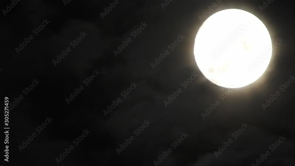 moon at night with cloud real time. 4k video full moon in the black sky. Clouds passing by moon at night. night sky with cloudy weather moon at night with cloud real time. 4k video full moon in the black sky. Clouds passing by moon at night. night sky with cloudy weather