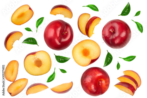 fresh red plum and half with leaves isolated on white background. Top view. Flat lay