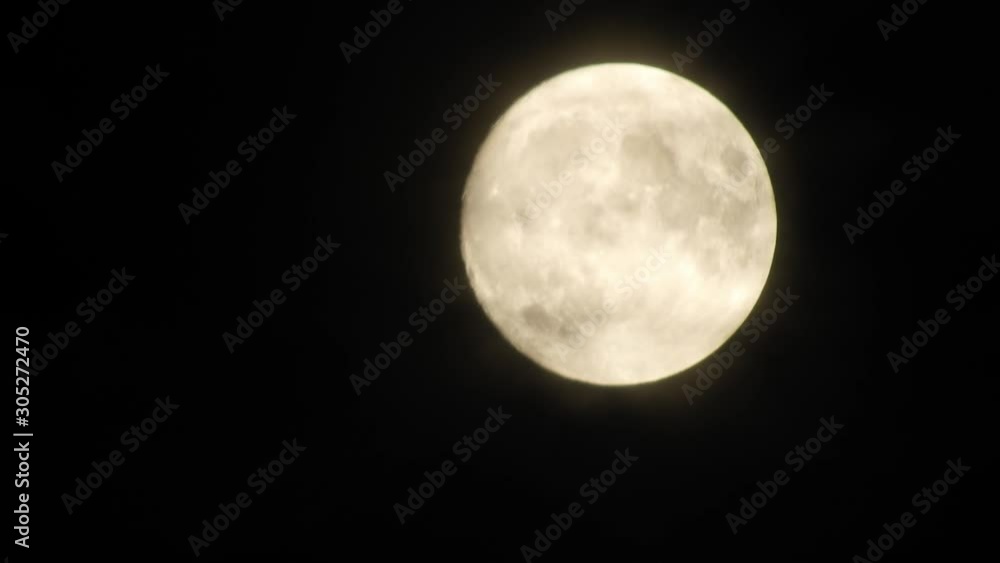 moon at night with cloud real time. 4k video full moon in the black sky. Clouds passing by moon at night. night sky with cloudy weather moon at night with cloud real time. 4k video full moon in the black sky. Clouds passing by moon at night. night sky with cloudy weather