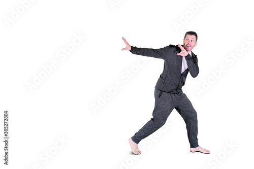 Scared man running away isolated over white