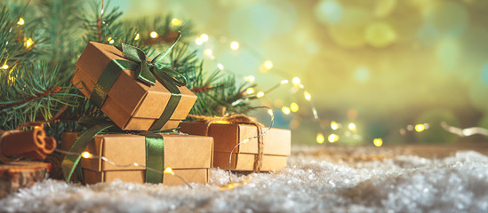 Christmas and zero waste, eco friendly packaging gifts in kraft paper on a wooden table, eco christmas holiday concept, eco decor banner