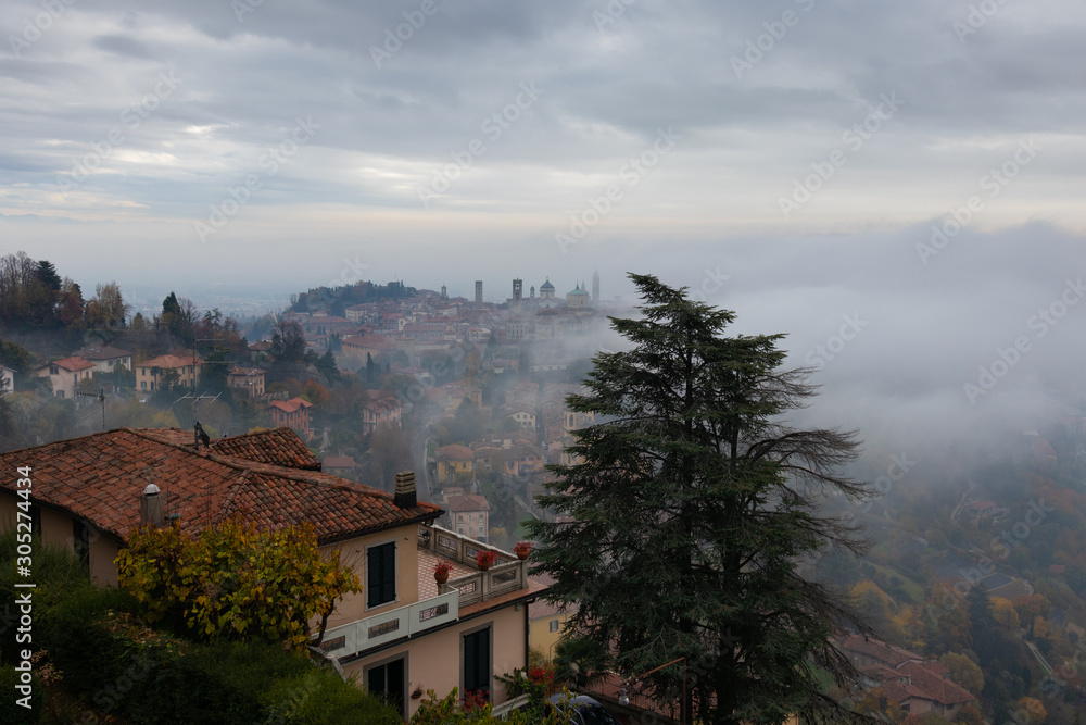 Fototapeta premium A thick fog enveloped the Upper city of Bergamo.
