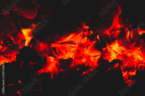 Beautiful red bright coals of bonfire. Close-up.