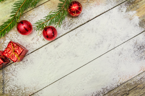 Christmas background with Christmas tree and Christmas decorations on wooden Board with copy space. view top