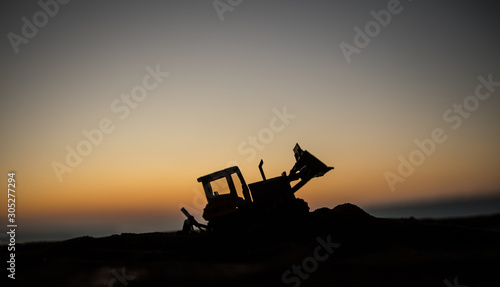 Canvas Print Abstract Industrial background with construction crane silhouette over amazing sunset sky