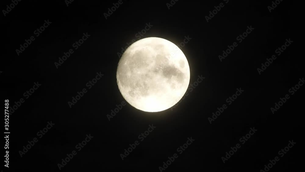 Full moon at night with cloud real time. 4k video full moon in the black sky. Clouds passing by moon at night. night sky with cloudy weather Full moon at night with cloud real time. 4k video full moon in the black sky. Clouds passing by moon at night. night sky with cloudy weather