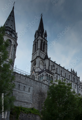 View of the basilica buildings above the Massabielle grotto at the Marian Shrine in Lourdes,