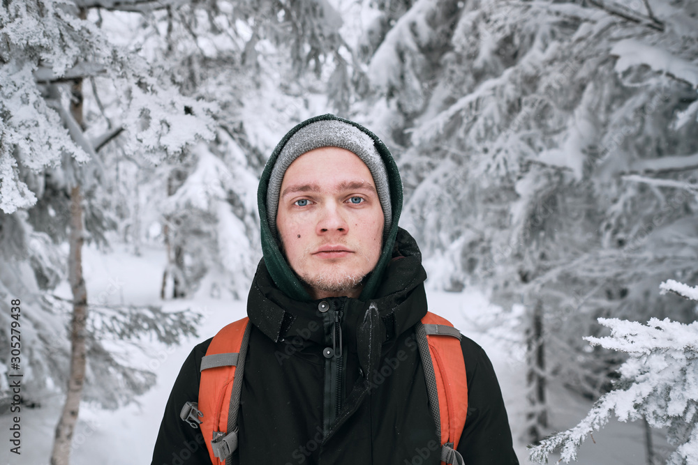 Man standing in the snowy winter forest Man standing in the snowy winter forest