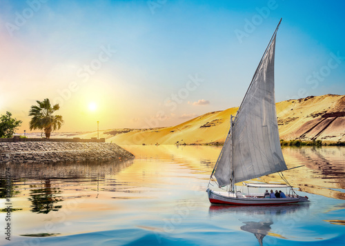Sunset and sailboat in Aswan