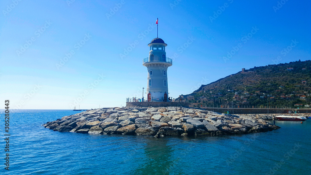 Lighthouse in the port of Alanya. Sea view of the lighthouse in Alanya Turkey.