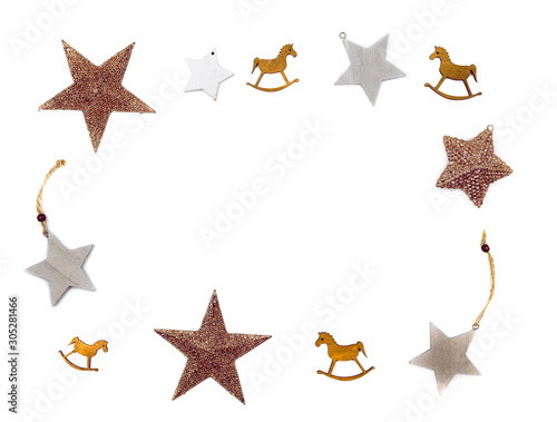 Golden christmas toy star and old wooden horses isolated on white background. Christmas, new year, winter concept. Flat lay, top view, copy space.