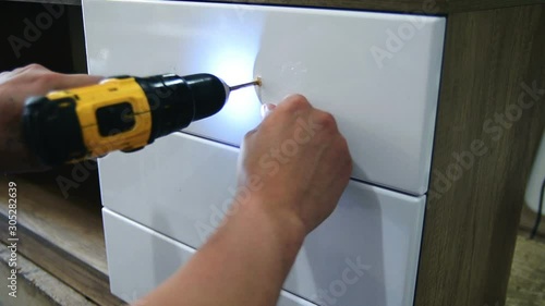 Wallpaper Mural Furniture fittings, wooden dowels for joining furniture elements from chipboard, close-up Torontodigital.ca