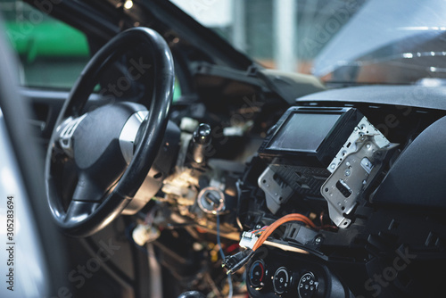 Disassembled car interior close up in car auto service.