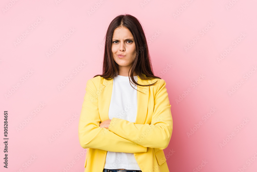 Young business woman frowning face in displeasure, keeps arms folded. Young business woman frowning face in displeasure, keeps arms folded.