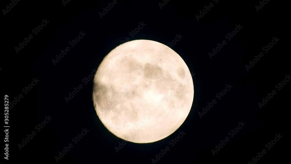 Full moon at night with cloud real time. 4k video full moon in the black sky. Clouds passing by moon at night. night sky with cloudy weather Full moon at night with cloud real time. 4k video full moon in the black sky. Clouds passing by moon at night. night sky with cloudy weather