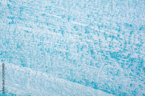 Beautiful Abstract Grunge Decorative Light Blue Cyan Painted Stucco Wall Texture. Handmade Rough Winter Christmas Paper Wide Background With Copy Space.