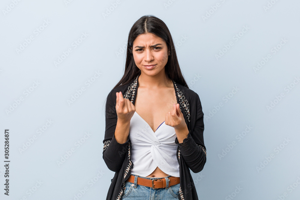 Young natural and pretty arab woman showing that she has no money. Young natural and pretty arab woman showing that she has no money.