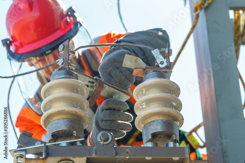 Working electrician working with electrical equipment