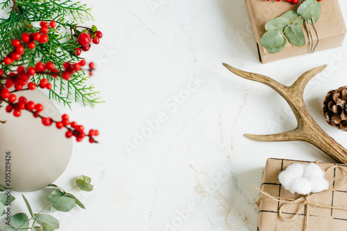 Eco friendly Christmas decorated gift boxes on white marble background