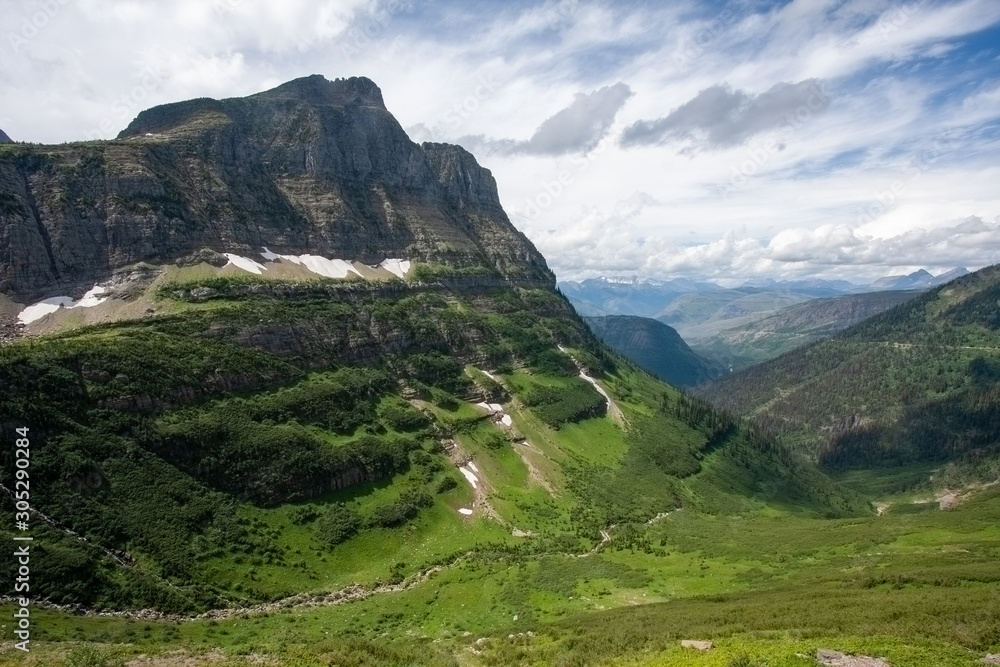 Dramatic and steep mountain slope. High line views across the mountains.