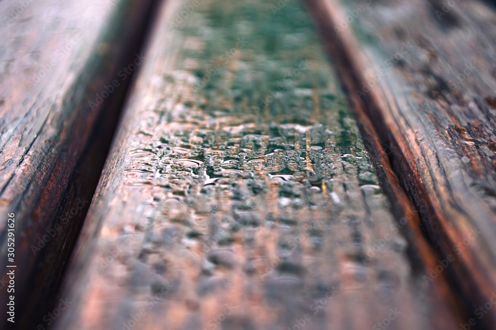Drop of rain on wooden boards