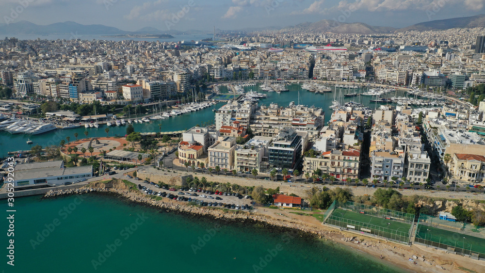 Aerial drone panoramic photo of iconic and busy port of Piraeus one of the largest in Mediterranean sea