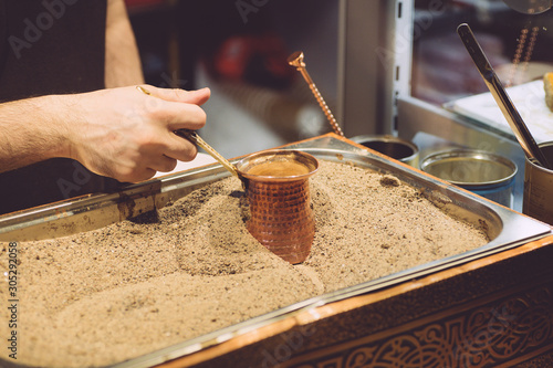 Photography Brewing Turkish coffee on hot sand