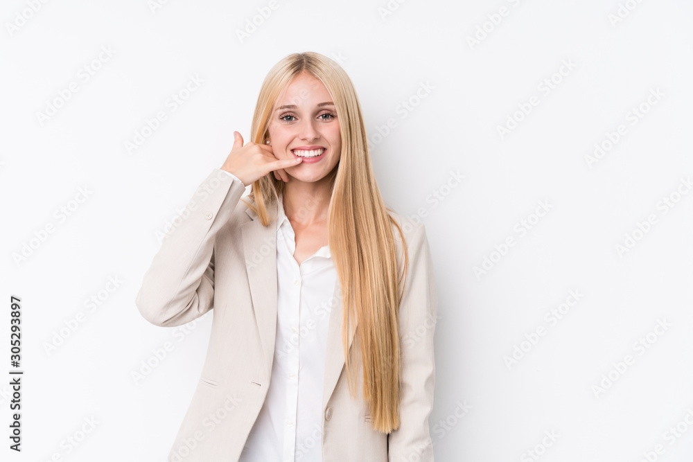Young business blonde woman on white background showing a mobile phone call gesture with fingers. Young business blonde woman on white background showing a mobile phone call gesture with fingers.
